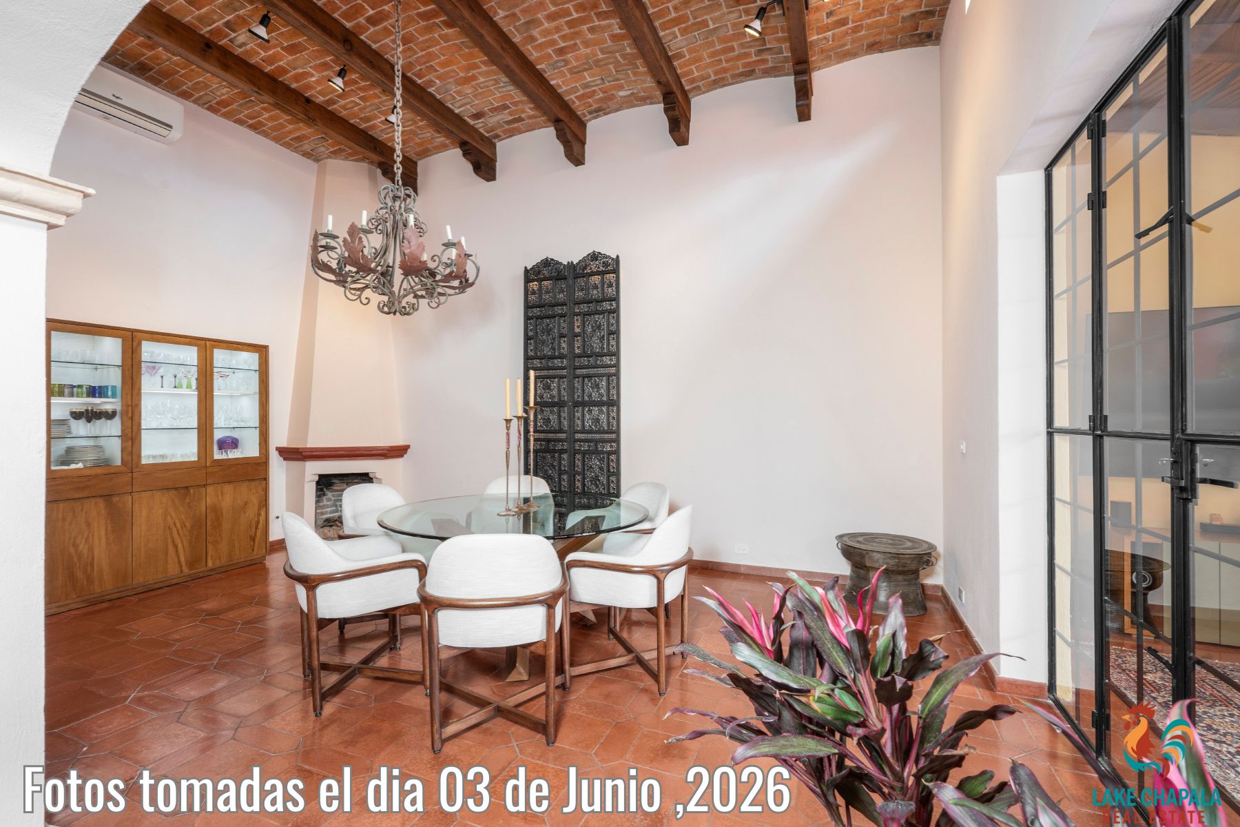 004 Dining Room with Beamed Ceiling and Fireplace
