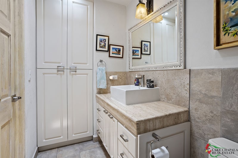 08 GUEST BATH WITH LINEN CLOSET AND ELEGANT CANTERRA MARBLE