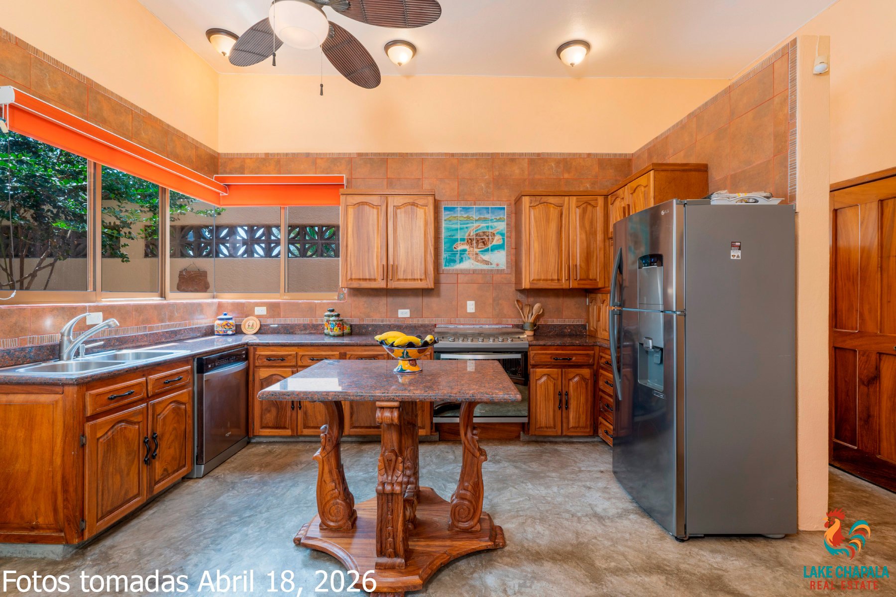 09 Kitchen with Tropical Parotta Wood Cabinets and Ocean View