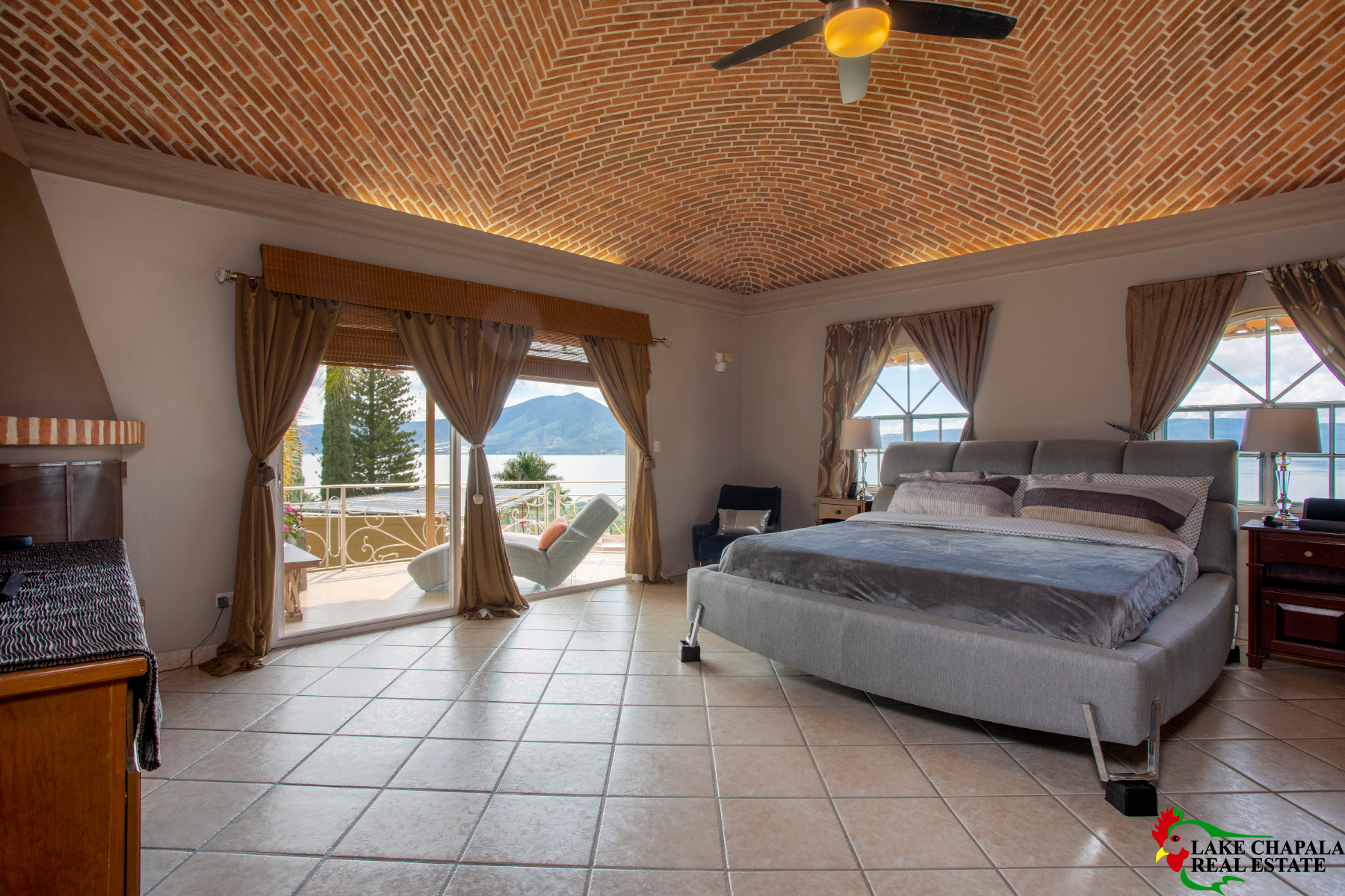 02 Master Bedroom with Brick Domed Ceiling, Fireplace and Lake Views