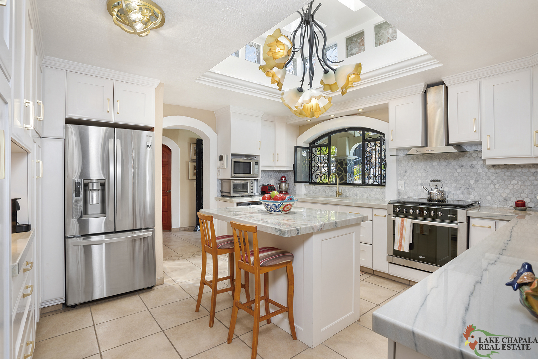 17 Bright Remodeled Kitchen with Sylight Tower and Marble Backsplash