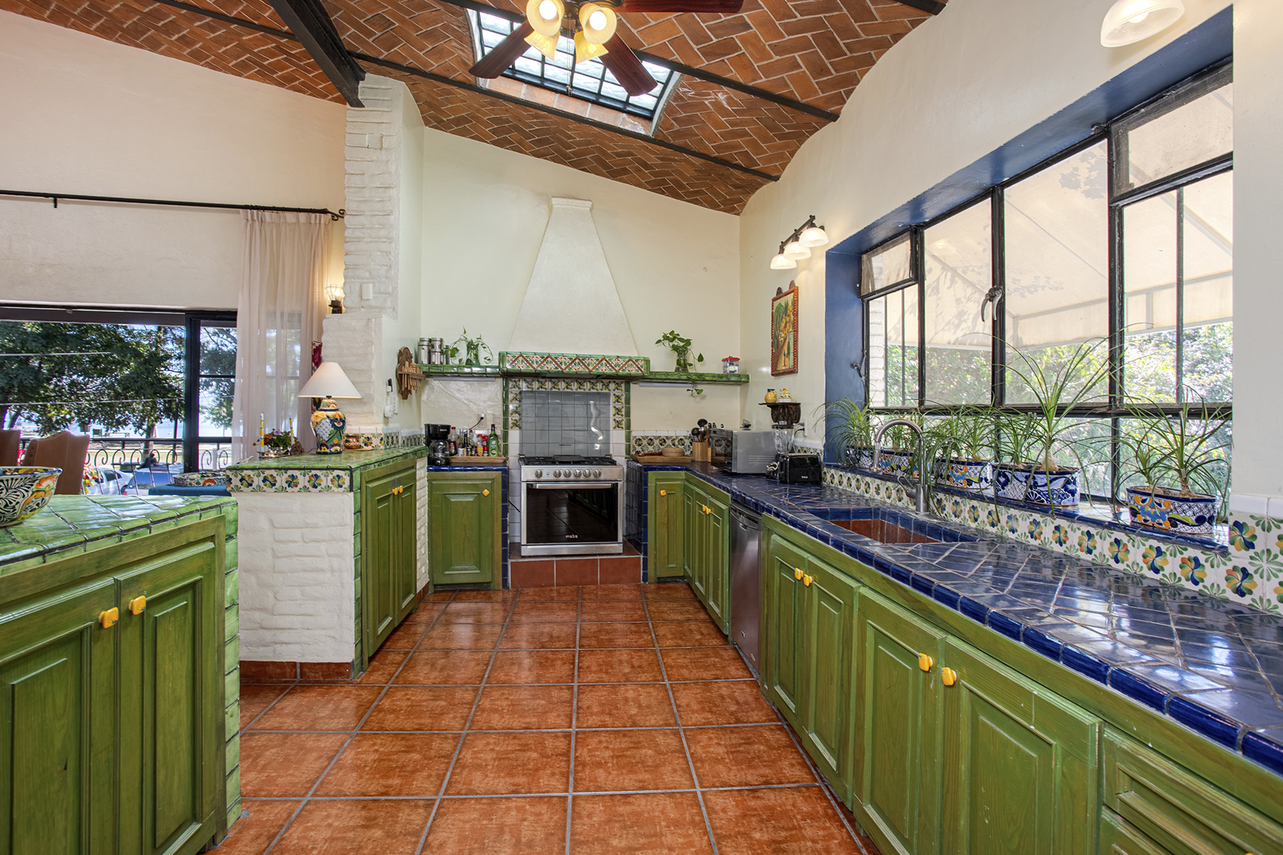 10 Tastefull Mexican Charm with Hand Painted Tiles and Custom Cabinets