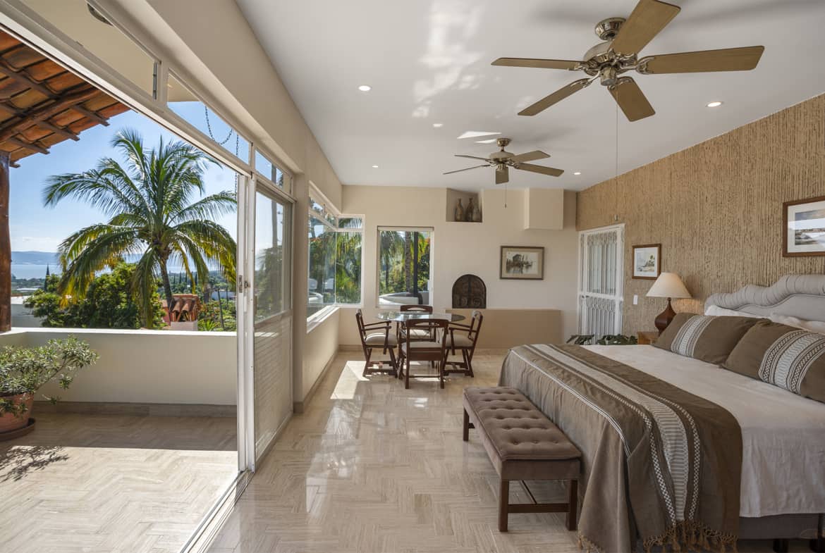 08 Expansive Master Suite with Fireplace and Panoramic Lake Views