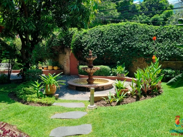 01 Lush Front Garden with Cantera Stone Fountain and Flagstone Terrace