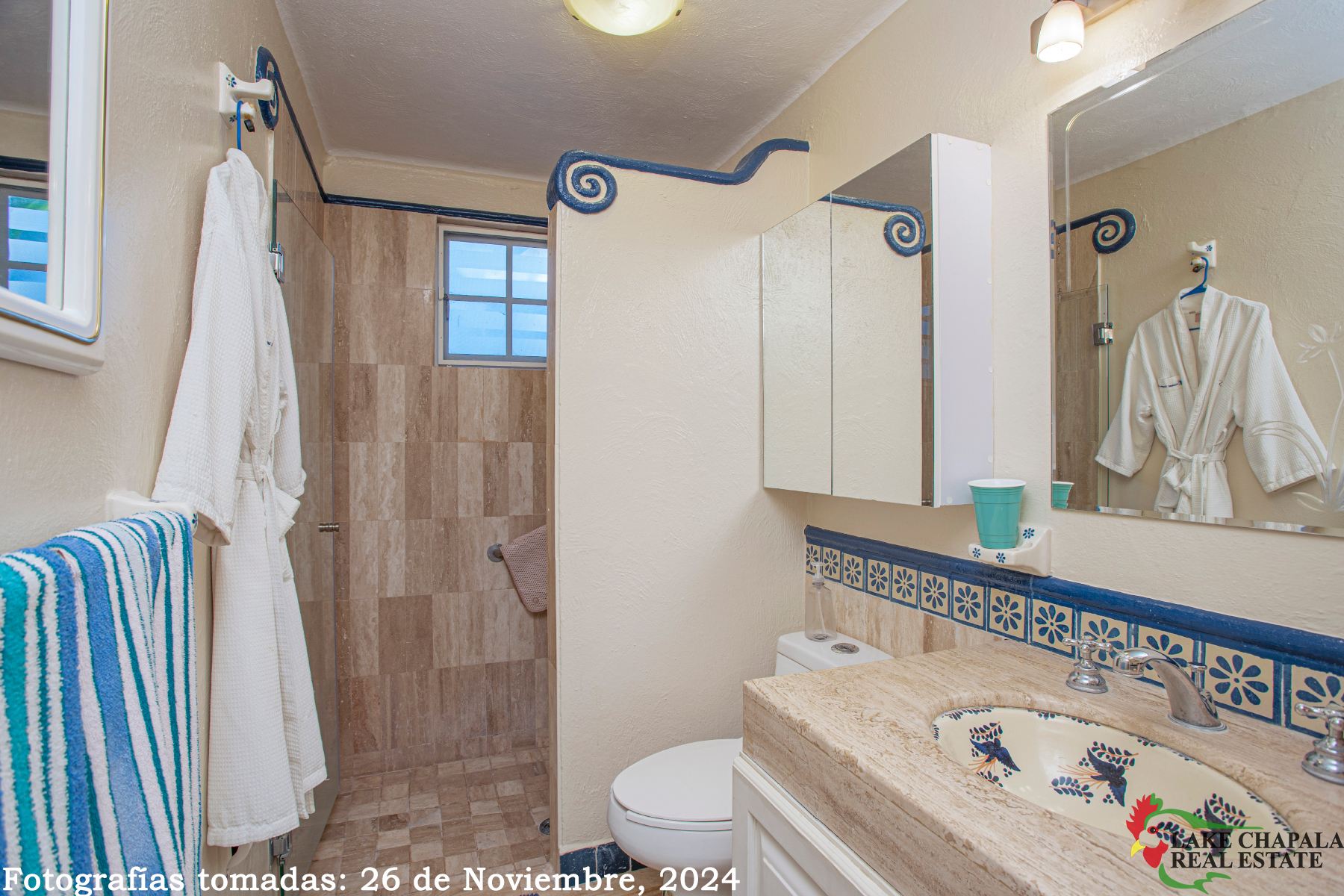 11 Guest Bath has Polished Marble Surfaces and Tile with Mexican Handpainted Tiles