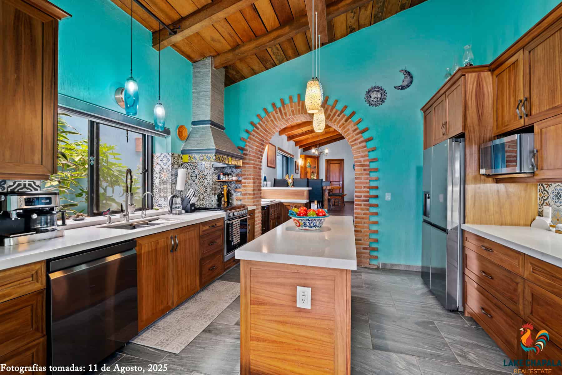 03 Renovated Kitchen with Cathedral Ceiling flows from the Dining Room and Wine Bar