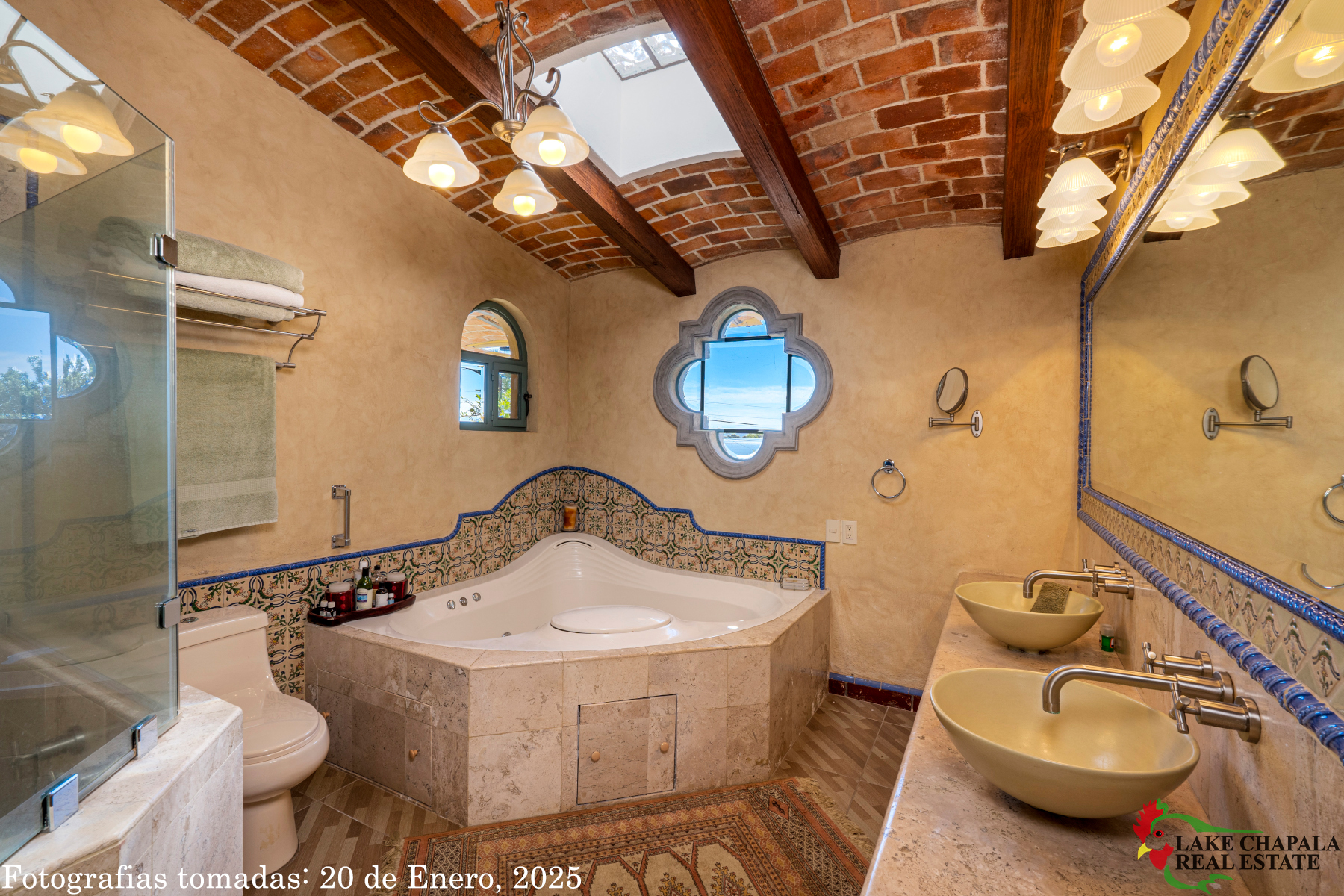 09 Master Bath has a Hydrotherapy Tub, Double Vanity, Skylight and Glass Walled Shower