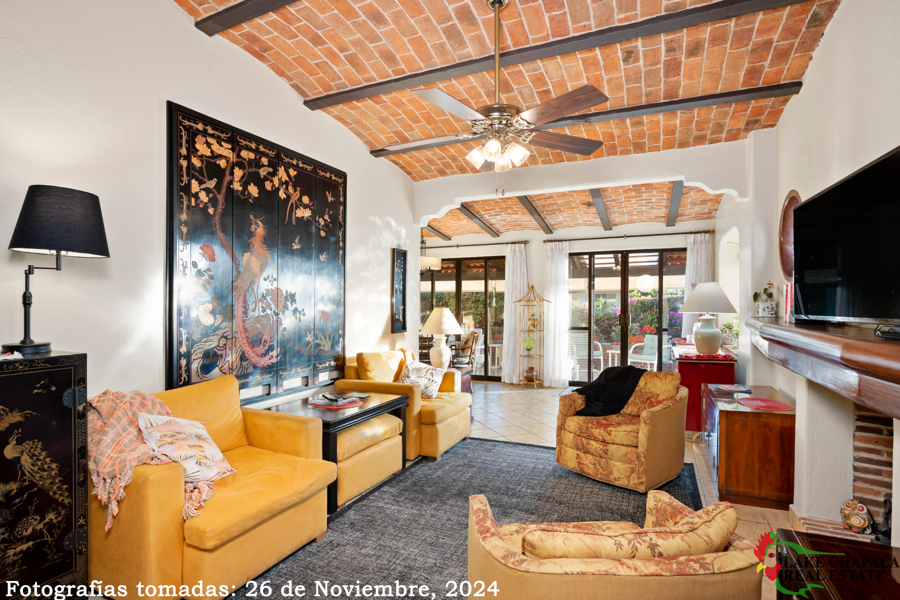 03 Stylish LivingRoom with Fireplace leads to Double Sliding Doors and the South Facing Terrace