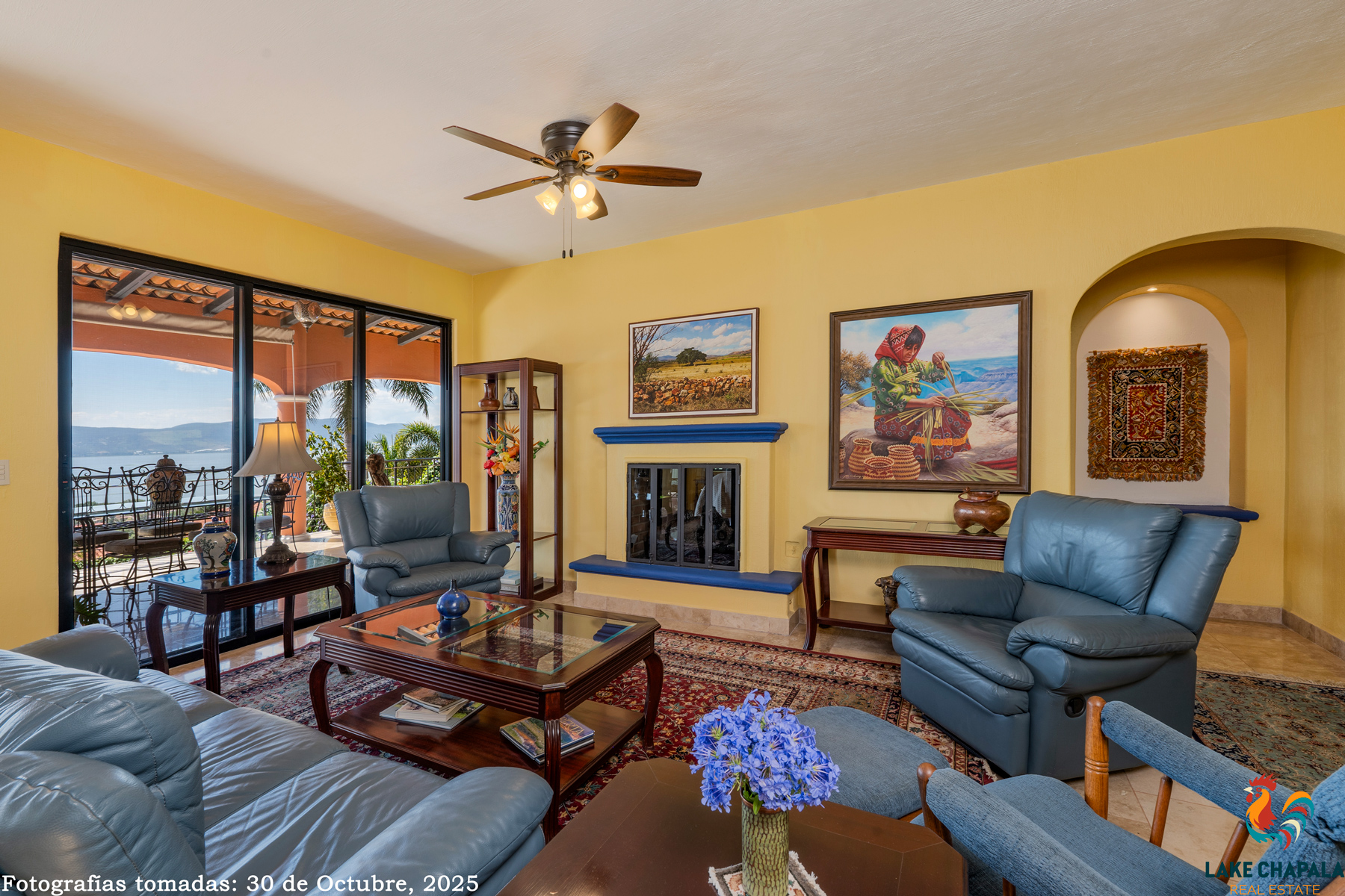 18 Living Room has a Fireplace for Cooler Evenings and Embraces the South Terrace and Lake Views